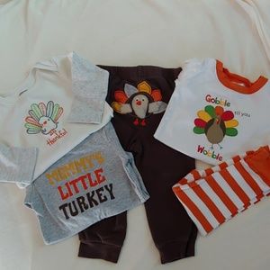 Lot of Thanksgiving baby outfits and jammies